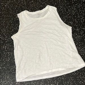 White crew neck tank with simple details on arms